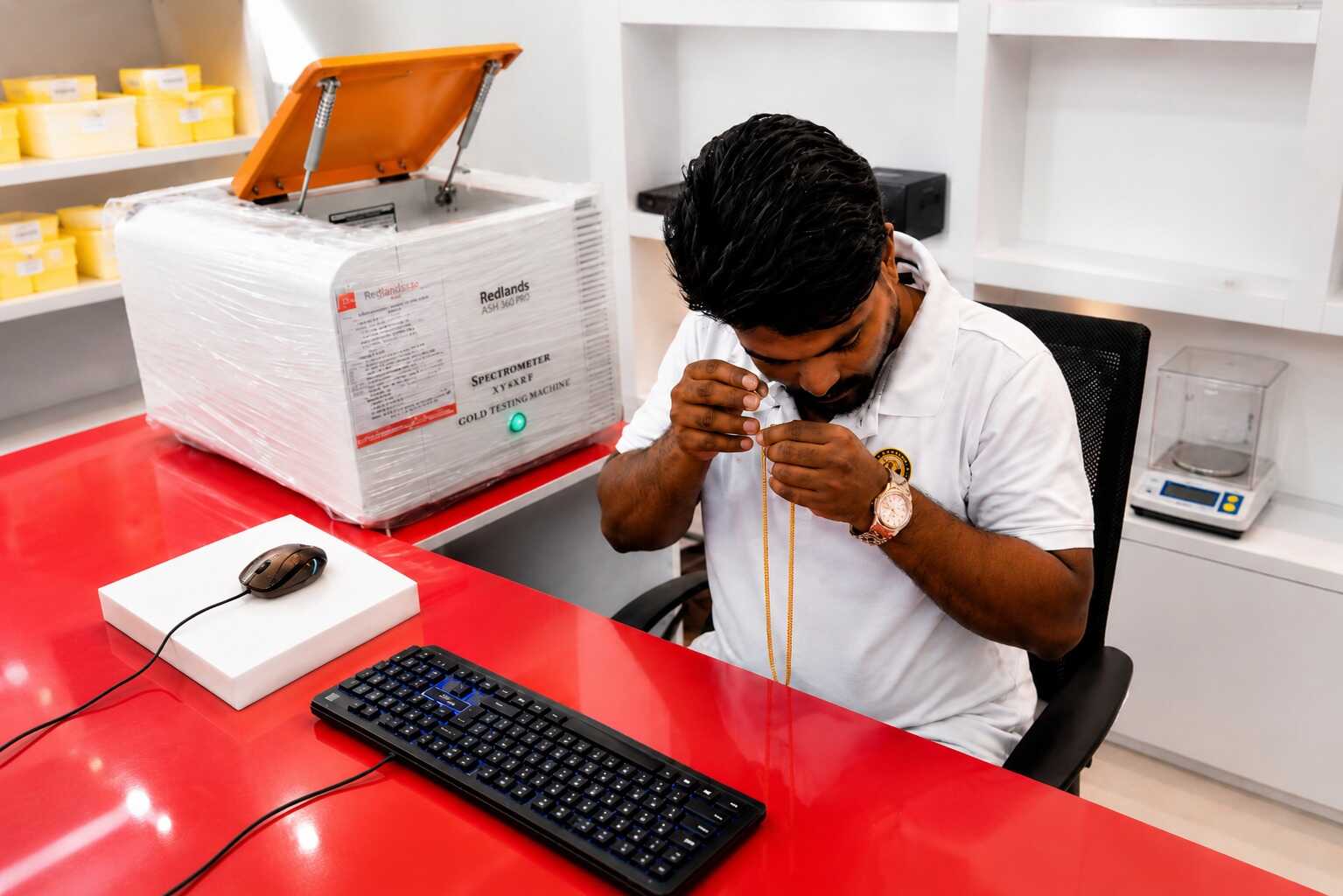 Professional gold testing and verification process ensuring accurate bulk gold buying valuations