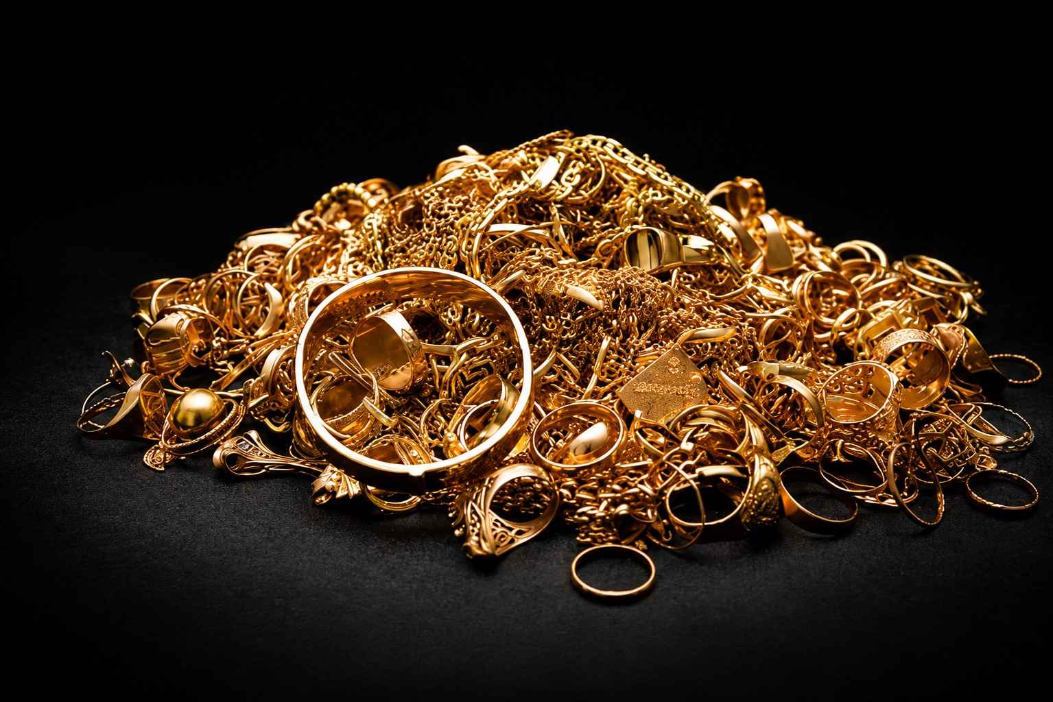 Collection of old gold jewellery, chains, rings and ornaments ready for valuation and sale
