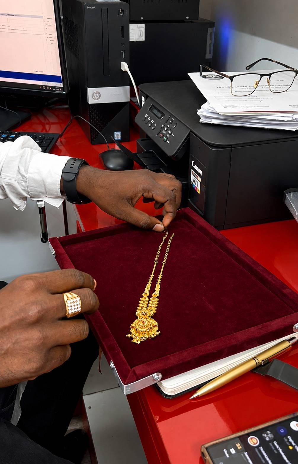 Gold necklace being carefully examined and assessed before determining its market value